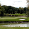 A view of green surrounded by water at Blue Fox Run Golf Club