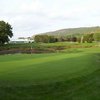 A view of a hole with water in background at Blue Fox Run Golf Club