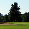 A view of green with bunker on the left at Long Hill Country Club