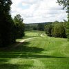 A view from fairway with cart path on the left at River Ridge Golf Course