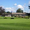 A view of the clubhouse and putting green at Lyman Orchards Golf Club