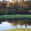 A view of green surrounded by water at Tradition Golf Club at Oak Lane