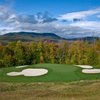 A view from the 16th green protected by bunkers at Sunday River Golf Club