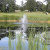 A view over the water of green at Windmill Hill Golf Course