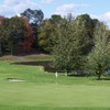 A view of green with water in background at Portland Golf Course West