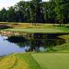Water guards the front and left rear of the 16th par-3 green at TPC of Boston.