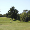 A view with golf cart coming from the left at  Lakeville Country Club