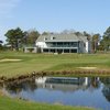 A view of the 18th green with clubhouse in background at Atlantic Country Club